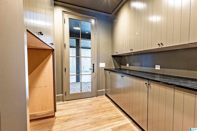 entryway featuring ornamental molding and light hardwood / wood-style floors