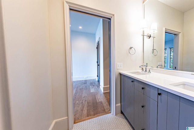 bathroom featuring hardwood / wood-style floors and vanity