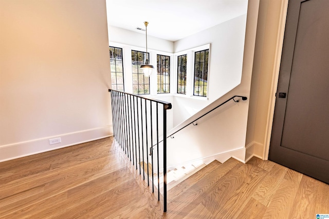 stairway with wood-type flooring