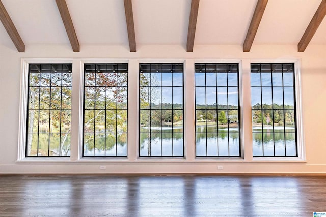 entryway featuring lofted ceiling with beams, a water view, and dark wood-type flooring