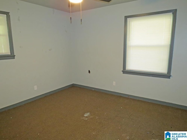 spare room with ceiling fan