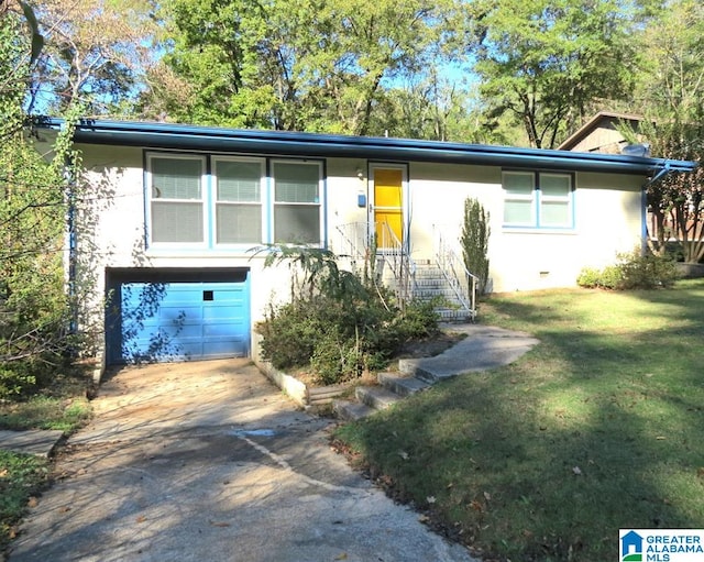 view of front of property with a front lawn and a garage