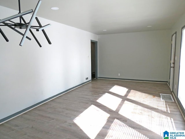 unfurnished room with dark wood-type flooring