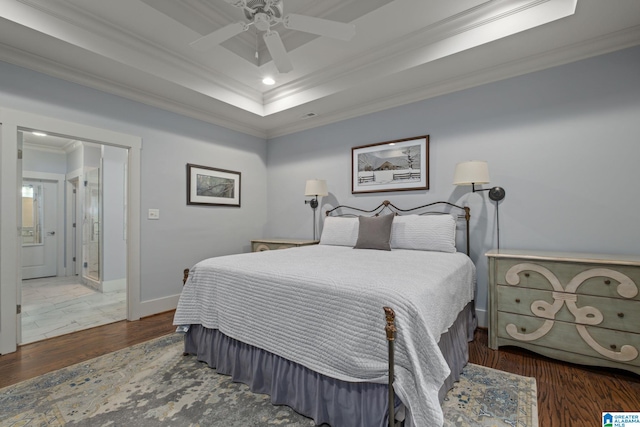 bedroom featuring dark hardwood / wood-style flooring, ornamental molding, and ceiling fan