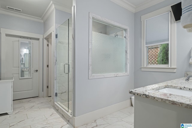 bathroom with vanity, an enclosed shower, and crown molding