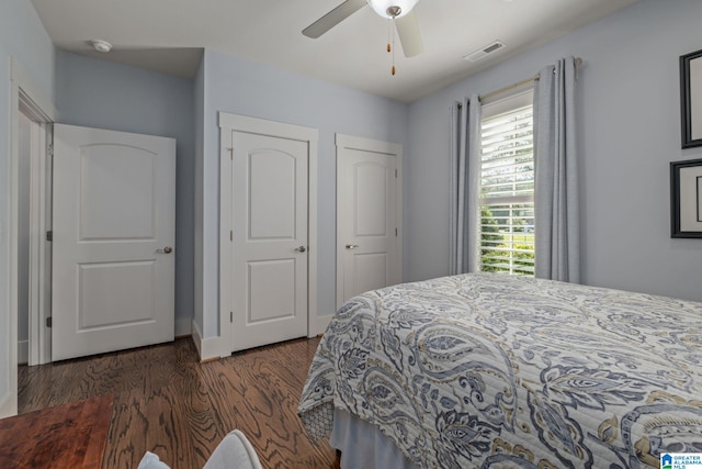 bedroom featuring dark wood-type flooring and ceiling fan