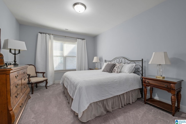 bedroom with light carpet