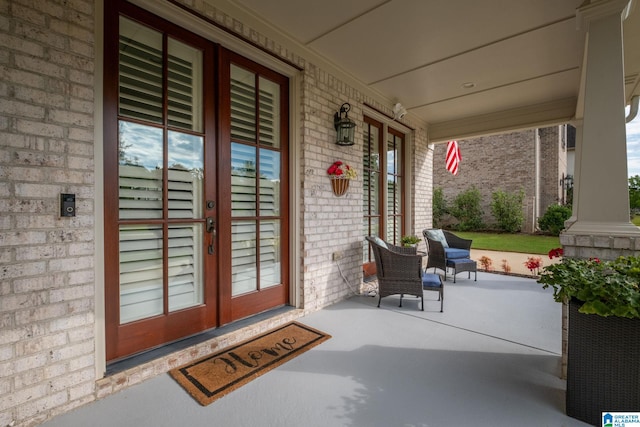 view of exterior entry featuring a porch