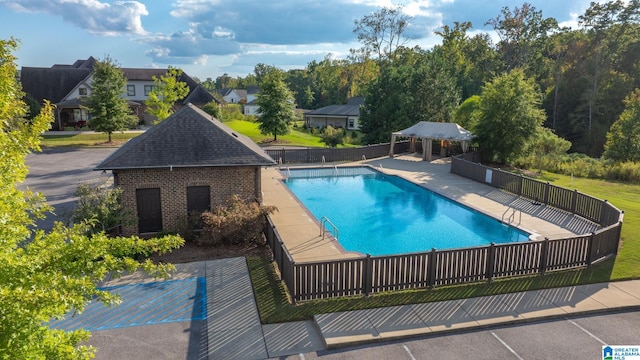 view of swimming pool with a patio