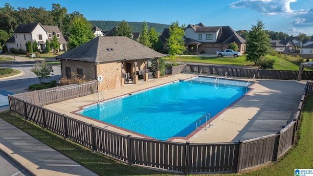 view of swimming pool featuring a patio area