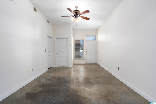 unfurnished room with ceiling fan