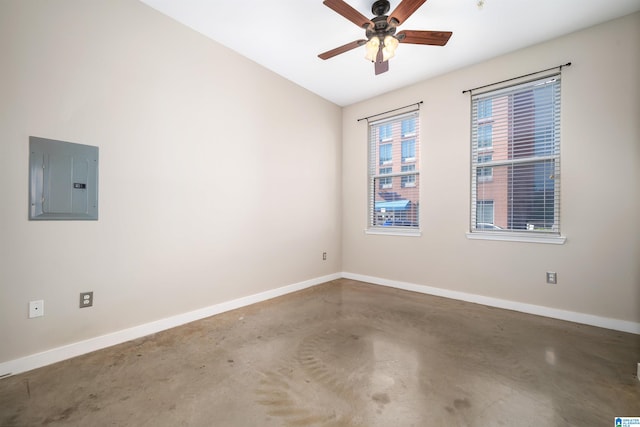 unfurnished room featuring concrete floors, electric panel, vaulted ceiling, and ceiling fan