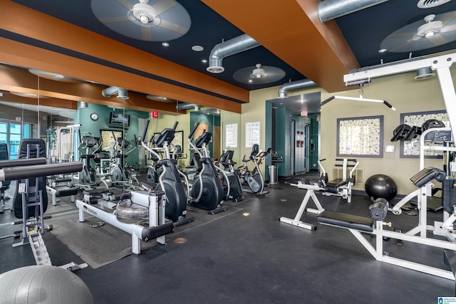 exercise room with ceiling fan