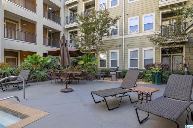 view of patio featuring a balcony and area for grilling