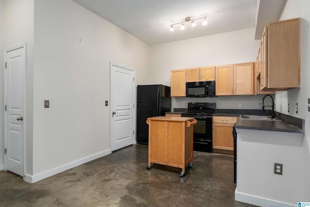 kitchen with light brown cabinets, black appliances, sink, and a kitchen island