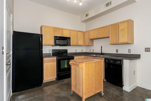 kitchen with a center island, black appliances, sink, and light brown cabinetry