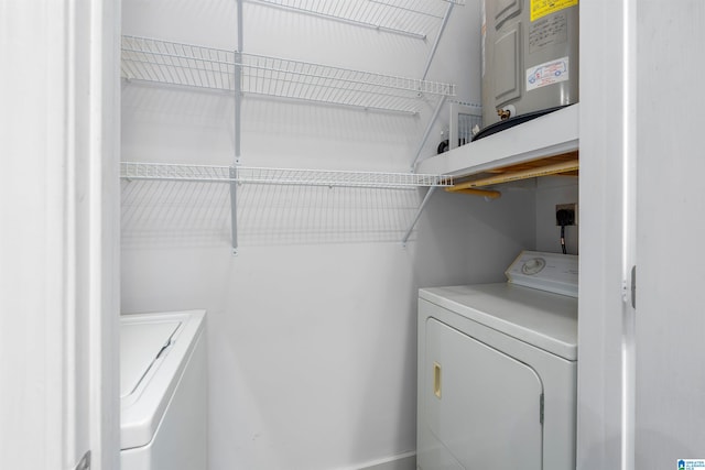 clothes washing area featuring washer and dryer