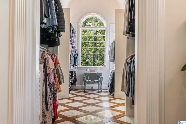 spacious closet featuring light parquet floors