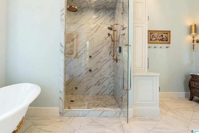 bathroom featuring shower with separate bathtub