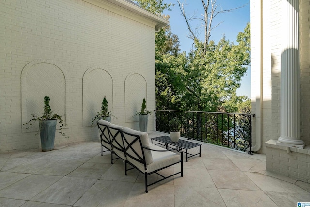 view of patio featuring a balcony