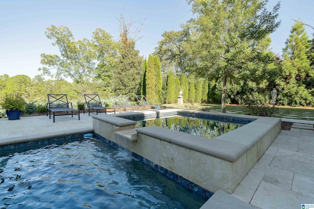 view of pool featuring a patio area