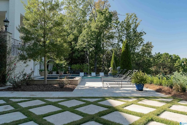 surrounding community featuring a patio area