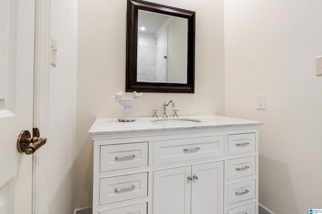 bathroom with vanity and walk in shower