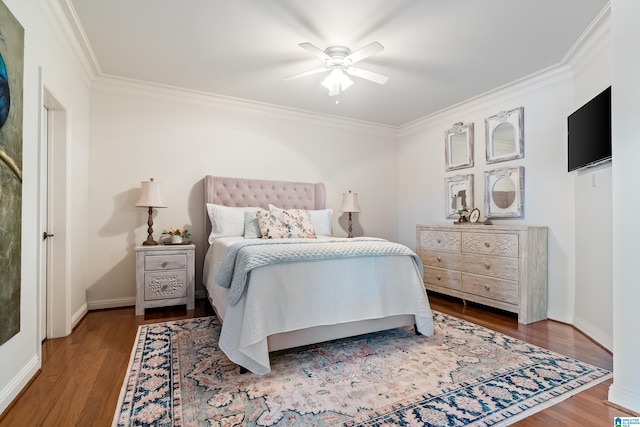 bedroom featuring ornamental molding, hardwood / wood-style floors, and ceiling fan