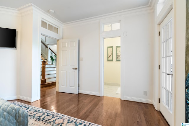 unfurnished bedroom with ornamental molding and dark hardwood / wood-style floors