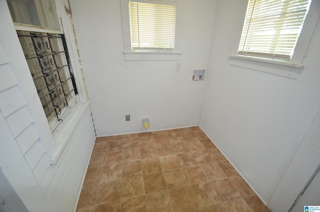 laundry area with hookup for a washing machine and a healthy amount of sunlight