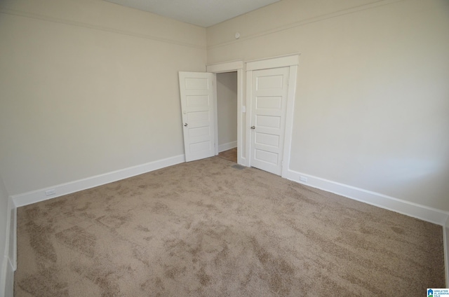 unfurnished bedroom featuring carpet flooring