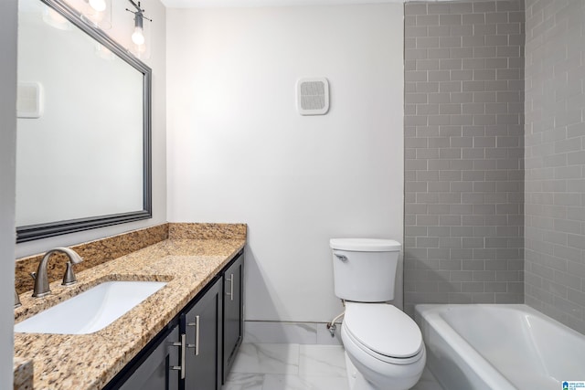 bathroom with vanity, toilet, and a bathing tub