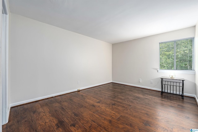 empty room featuring dark wood-type flooring