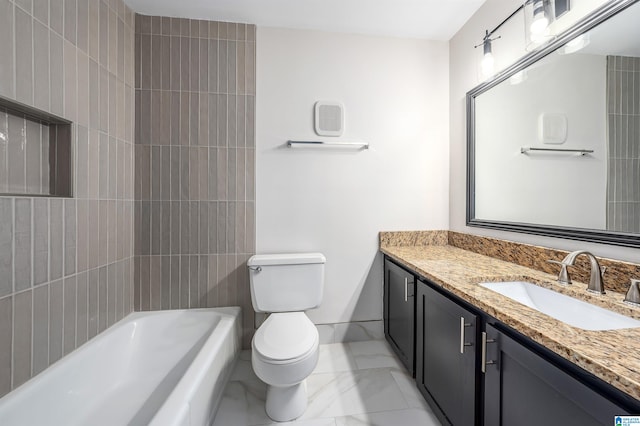 bathroom with toilet, a tub, and vanity