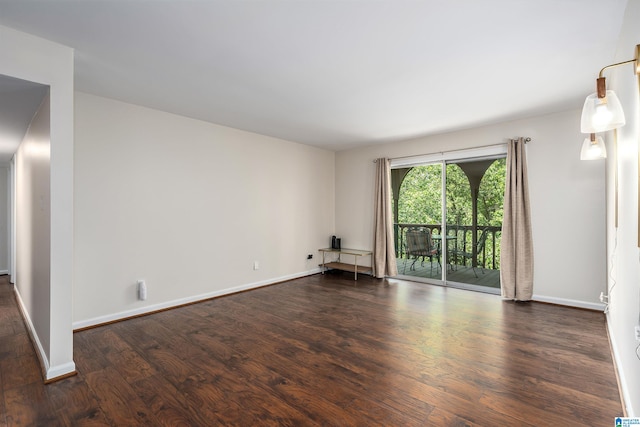 empty room featuring dark wood-type flooring