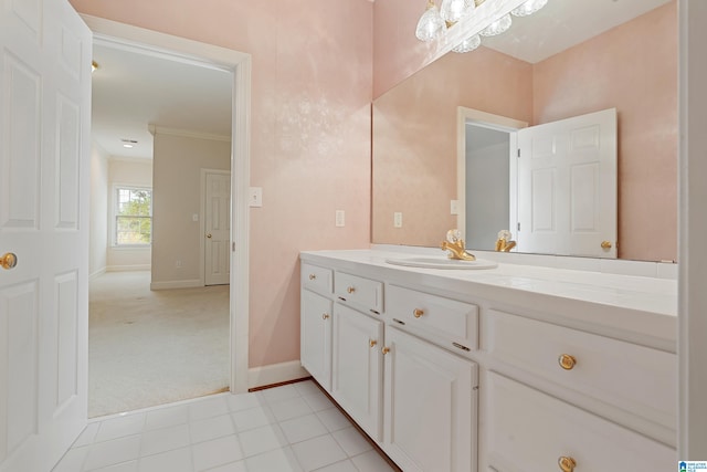 bathroom with vanity and ornamental molding