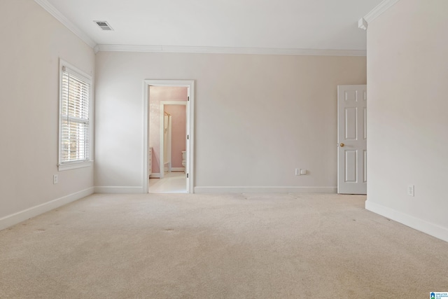 carpeted empty room with crown molding