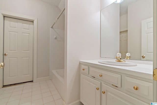 bathroom with tile patterned flooring, shower / bath combination, and vanity