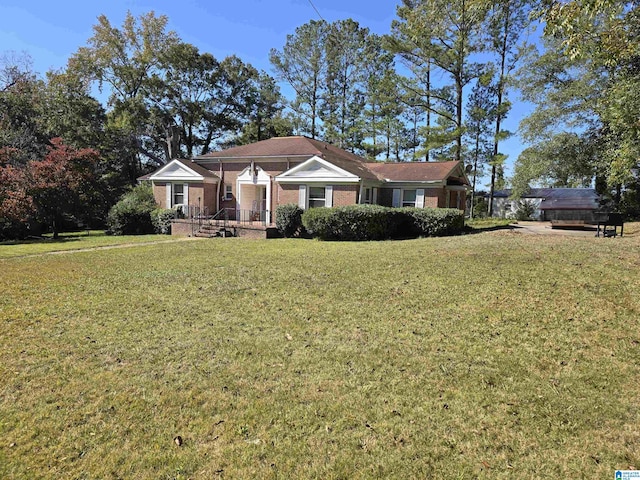 ranch-style home with a front yard