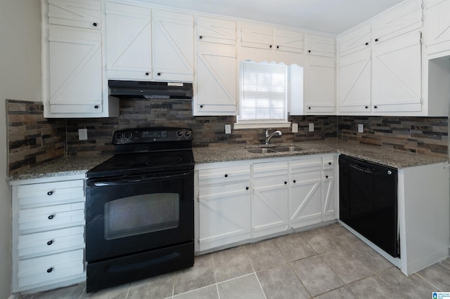 kitchen featuring black appliances, white cabinets, and dark stone countertops