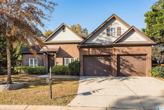 view of front of house featuring a garage and a front lawn