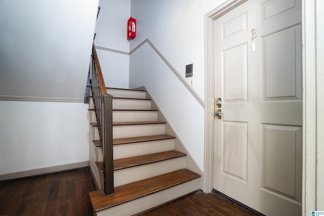 staircase featuring hardwood / wood-style flooring