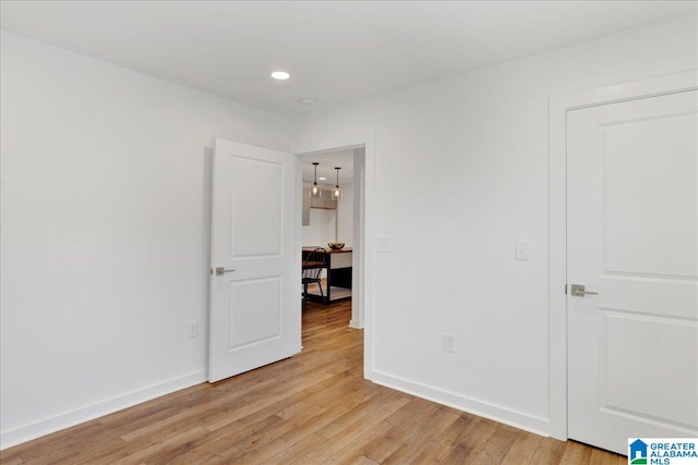 empty room with light hardwood / wood-style floors