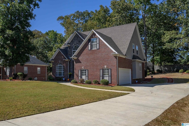 front facade with a front lawn and a garage