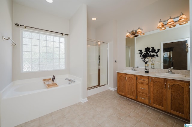 bathroom with vanity and independent shower and bath