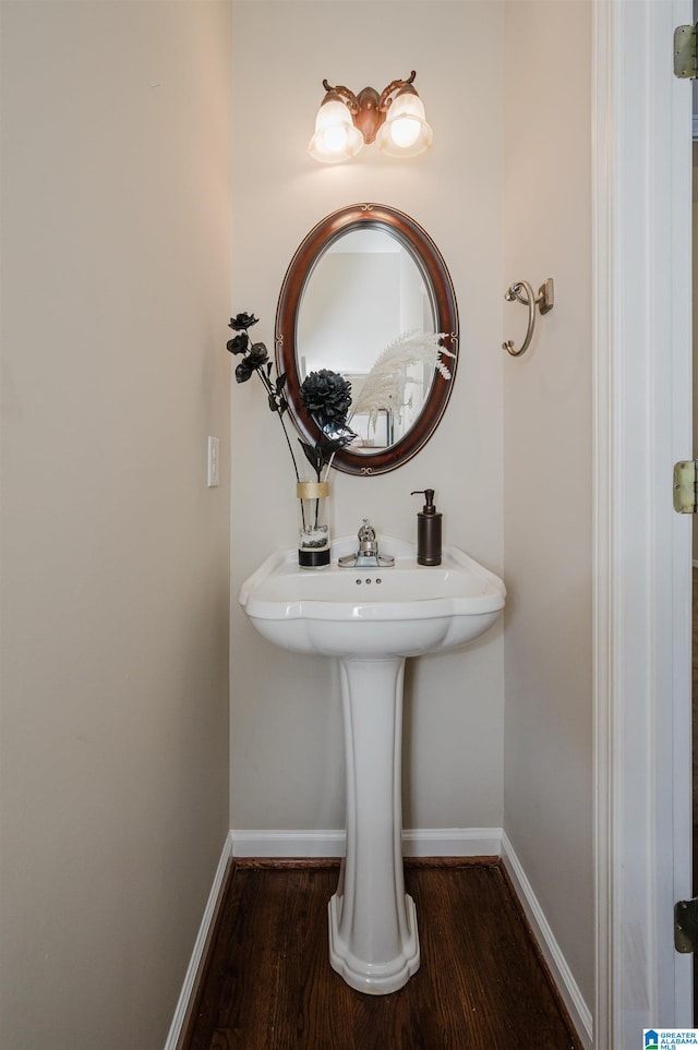 bathroom with wood-type flooring