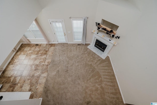 foyer featuring light carpet