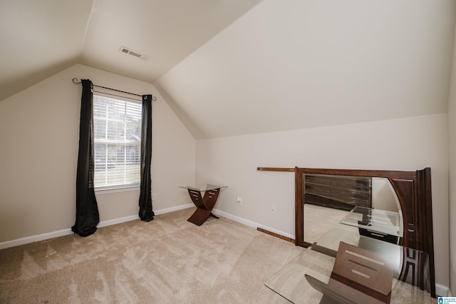 additional living space with lofted ceiling and light colored carpet