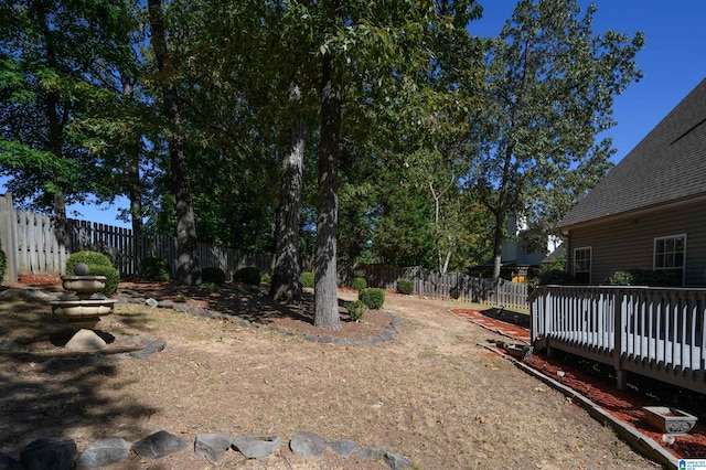 view of yard with a wooden deck