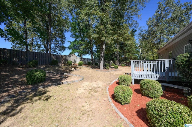 view of yard with a wooden deck